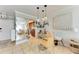 Small dining area with glass table and modern light fixtures at 115 Tyler Dr # 203, Sarasota, FL 34236