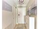 Bright and airy entryway with a white dresser and decor at 115 Tyler Dr # 203, Sarasota, FL 34236