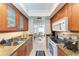 Open kitchen with view to living area, granite counters at 115 Tyler Dr # 203, Sarasota, FL 34236