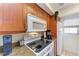 Well-equipped kitchen featuring a microwave and electric stovetop at 115 Tyler Dr # 203, Sarasota, FL 34236