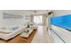 Living room with white sectional sofa and large TV at 115 Tyler Dr # 203, Sarasota, FL 34236