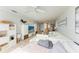 Open concept living area with white sectional sofa and view of dining area at 115 Tyler Dr # 203, Sarasota, FL 34236