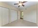 Bright bedroom with double closets and ceiling fan at 1195 Villagio Cir # 201, Sarasota, FL 34237