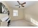 Bedroom with window, ceiling fan and piano at 1195 Villagio Cir # 201, Sarasota, FL 34237