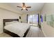 Main bedroom with wood floors and access to balcony at 1195 Villagio Cir # 201, Sarasota, FL 34237
