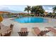 Inviting community pool with plenty of lounge chairs at 1195 Villagio Cir # 201, Sarasota, FL 34237