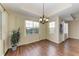 Bright dining room with wood floors and large windows at 1195 Villagio Cir # 201, Sarasota, FL 34237