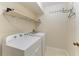 Laundry room with Whirlpool washer and dryer at 1195 Villagio Cir # 201, Sarasota, FL 34237