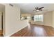 Living room with wood floors and a ceiling fan at 1195 Villagio Cir # 201, Sarasota, FL 34237