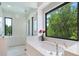 Luxurious bathroom with a soaking tub and walk-in shower at 1245 Mill Creek Rd, Bradenton, FL 34212