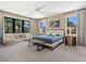Comfortable guest bedroom with plush carpeting and large windows at 1245 Mill Creek Rd, Bradenton, FL 34212