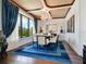 Formal dining room with unique ceiling and large windows at 1245 Mill Creek Rd, Bradenton, FL 34212