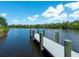 Wooden dock on a calm river or lake setting at 1245 Mill Creek Rd, Bradenton, FL 34212