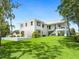 Luxury home exterior with expansive lawn at 1245 Mill Creek Rd, Bradenton, FL 34212