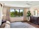 Serene main bedroom features a king-size bed, water views, and hardwood floors at 1245 Mill Creek Rd, Bradenton, FL 34212