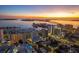 Stunning aerial view of the city skyline at sunset, showcasing the property's prime location at 1335 2Nd St # 301, Sarasota, FL 34236