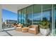 Relaxing balcony with wicker chairs and city views at 1335 2Nd St # 301, Sarasota, FL 34236