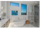 Spa-like bathroom with soaking tub, walk-in shower, and modern finishes at 1335 2Nd St # 301, Sarasota, FL 34236