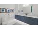 Elegant bathroom featuring a large mirror and stylish cabinetry at 1335 2Nd St # 301, Sarasota, FL 34236