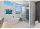 Spa-like bathroom with a soaking tub, walk-in shower, and modern design at 1335 2Nd St # 301, Sarasota, FL 34236