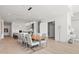 Open concept dining area with modern light fixture and adjacent kitchen at 1335 2Nd St # 301, Sarasota, FL 34236