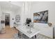 Spacious home office showcasing large art pieces and city views at 1335 2Nd St # 301, Sarasota, FL 34236