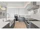 Modern kitchen with stainless steel appliances and light wood flooring at 1335 2Nd St # 301, Sarasota, FL 34236