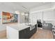 Modern kitchen with island, stainless steel appliances, and white quartz countertops at 1335 2Nd St # 301, Sarasota, FL 34236