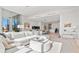 Open living room with white sectional sofa and city views at 1335 2Nd St # 301, Sarasota, FL 34236