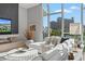 Spacious living room with fireplace and large windows offering city views at 1335 2Nd St # 301, Sarasota, FL 34236