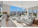 Spacious living room with floor-to-ceiling windows and city views at 1335 2Nd St # 301, Sarasota, FL 34236