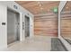 Elegant lobby with two elevators and a wood-paneled wall at 1335 2Nd St # 301, Sarasota, FL 34236
