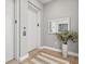 Elegant building lobby with modern finishes and a stylish mirror at 1335 2Nd St # 301, Sarasota, FL 34236