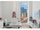 Home office with a large window, city view, and modern desk at 1335 2Nd St # 301, Sarasota, FL 34236