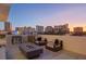 Private rooftop patio with fire pit, seating area, and city views at 1335 2Nd St # 301, Sarasota, FL 34236