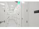 Clean and well-lit hallway of storage units at 1335 2Nd St # 301, Sarasota, FL 34236