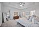 Main bedroom with king-size bed, dresser, and large mirror at 15344 Serene Shores Loop, Bradenton, FL 34211