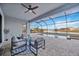 Relaxing screened-in pool area with patio furniture at 15344 Serene Shores Loop, Bradenton, FL 34211