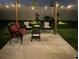 Cozy backyard patio with seating and string lights at 17921 Canopy Pl, Bradenton, FL 34211