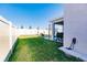 Backyard with grassy area, patio, grill, and privacy fence at 17921 Canopy Pl, Bradenton, FL 34211