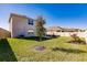 Spacious backyard with grassy area, patio, and privacy fence at 17921 Canopy Pl, Bradenton, FL 34211