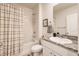 Clean bathroom with shower/tub combo, granite vanity, and updated fixtures at 17921 Canopy Pl, Bradenton, FL 34211