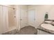 Bathroom with shower, double vanity, and granite countertops at 17921 Canopy Pl, Bradenton, FL 34211