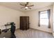 Bright bedroom with carpeted floor, ceiling fan, and window coverings at 17921 Canopy Pl, Bradenton, FL 34211