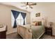 Light and airy bedroom with ceiling fan and double doors to closet at 17921 Canopy Pl, Bradenton, FL 34211