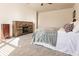 Bright bedroom with queen bed and built-in fireplace at 17921 Canopy Pl, Bradenton, FL 34211