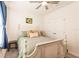 Bedroom with a queen-size bed, ceiling fan and double door closet at 17921 Canopy Pl, Bradenton, FL 34211