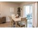 Bright dining area with sliding glass doors leading to backyard at 17921 Canopy Pl, Bradenton, FL 34211