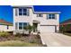 Two-story house with gray shutters, stone accents, and a two-car garage at 17921 Canopy Pl, Bradenton, FL 34211