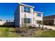 Two-story house with gray shutters, stone accents, and a two-car garage at 17921 Canopy Pl, Bradenton, FL 34211